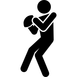 Rugby player silhouette with the ball in hands icon