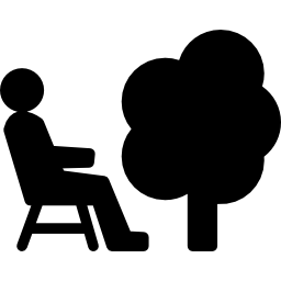 Person sitting on a chair beside a tree icon