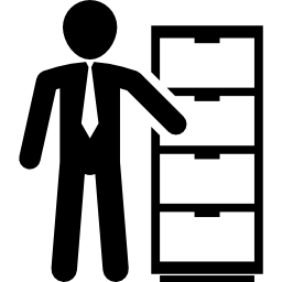 Businessman standing beside a drawer icon