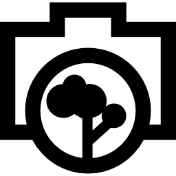 Photo camera outline with a tree objective icon