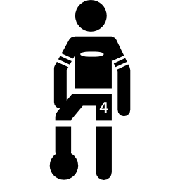 joueur de football debout avec le ballon sous un pied Icône