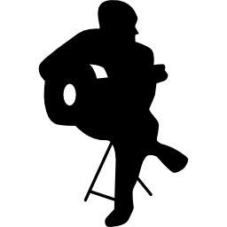 フラメンコ ギタリストの座っているシルエット icon