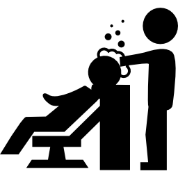 Hairdresser washing the hair of a client with bubbles shampoo icon