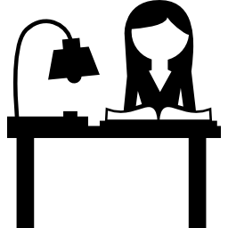 Student reading on a desk icon