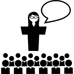 grupo escolar con una estudiante hablando frente a la audiencia icono