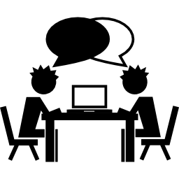 Students talking on a table with a computer icon