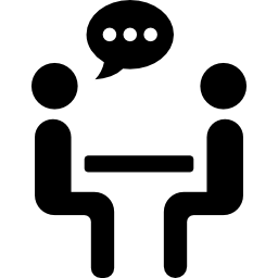 dwie osoby rozmawiają, dzieląc się, siedząc na stole ikona