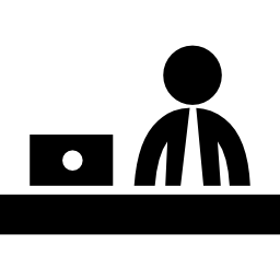 Businessman working behind a desk of office icon