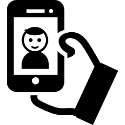 Selfie of a boy on phone screen in his hand icon