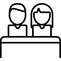 couple homme et femme avec une table Icône