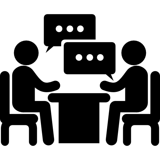 casal de homens sentados em uma mesa falando sobre negócios  Ícone